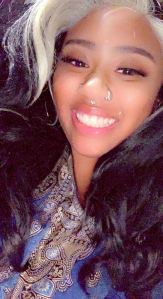 Photo shows Jazzmine Jacks smiling at the camera as she takes a selfie